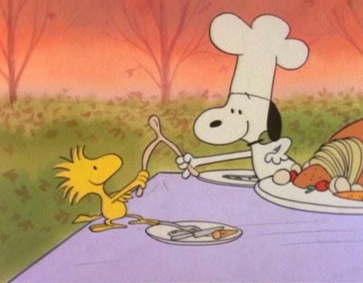 This may contain: a cartoon character holding a fork and knife in front of a plate with food on it