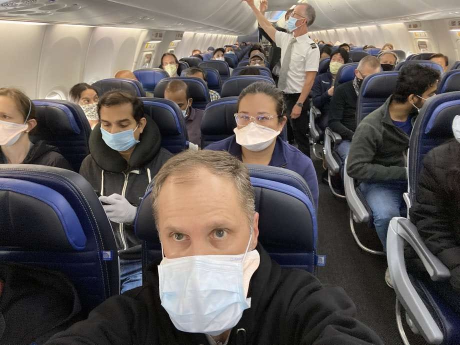 UCSF cardiologist Ethan Weiss took a selfie to show a nearly full United Airlines flight to San Francisco. Photo: Ethan Weiss UCSF cardiologist Ethan Weiss took a selfie to show a nearly full United Airlines flight to San Francisco. Photo: Ethan Weiss