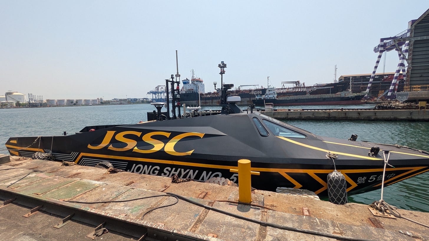 Jong Shyn Shipbuilding’s experimental unmanned surface vessel Jong Shyn No. 5 docked at a harbor, with black and yellow JSSC markings visible on the hull. Jong Shyn Shipbuilding’s experimental unmanned surface vessel Jong Shyn No. 5 docked at a harbor, with black and yellow JSSC markings visible on the hull.