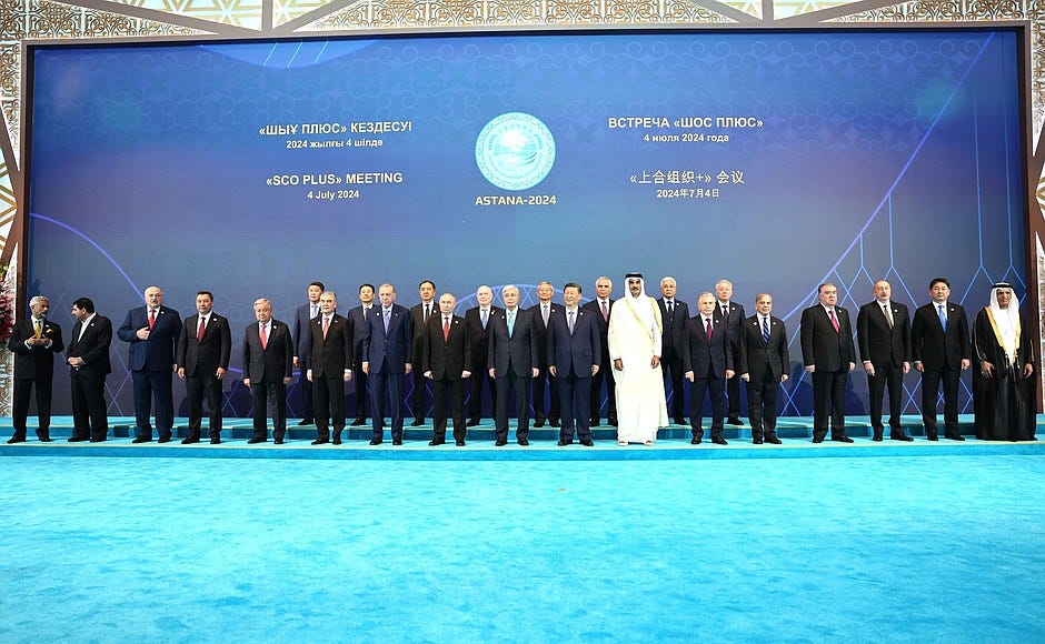 Group photo of participants in the SCO Plus format meeting.