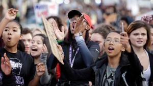 In this Nov. 14, 2016 file photo, students from Garfield High School march to rally with other students who walked out to protest the election of Donald Trump as president in Seattle. (AP Photo/Elaine Thompson, File) In this Nov. 14, 2016 file photo, students from Garfield High School march to rally with other students who walked out to protest the election of Donald Trump as president in Seattle. (AP Photo/Elaine Thompson, File)