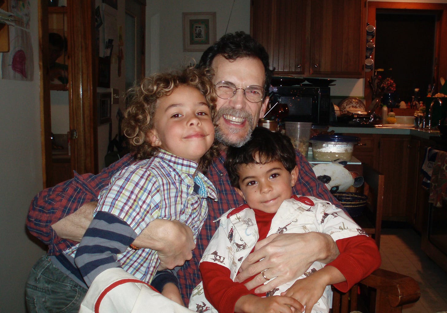 Alex grinning, that last Xmas with my kids on his lap