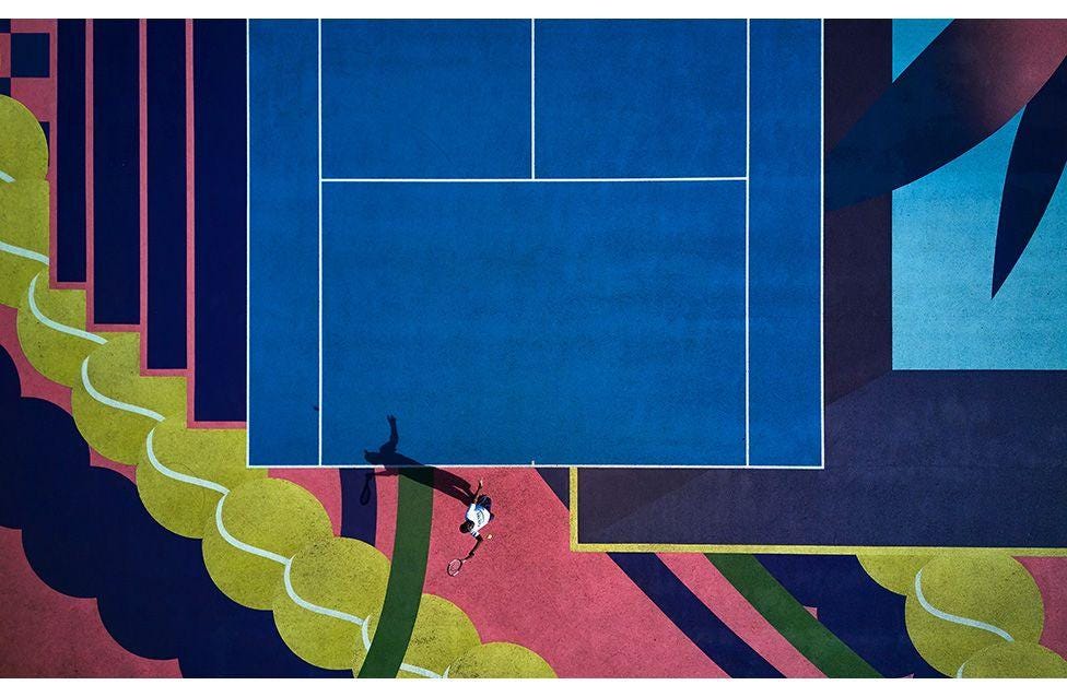 An aerial view over Bostall Gardens in London as local tennis player Isaac Attram serves