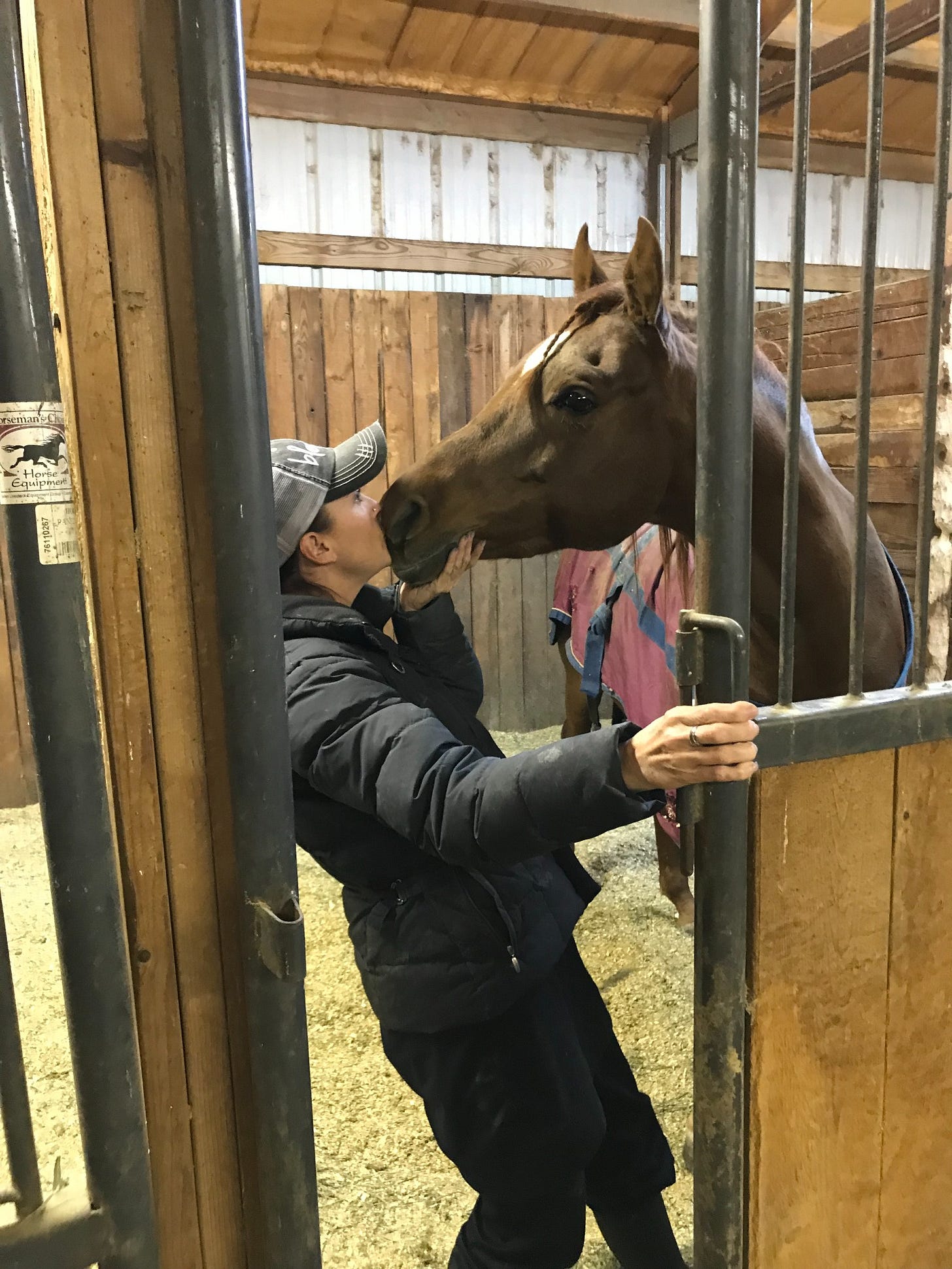 Candice at the barn with a horse