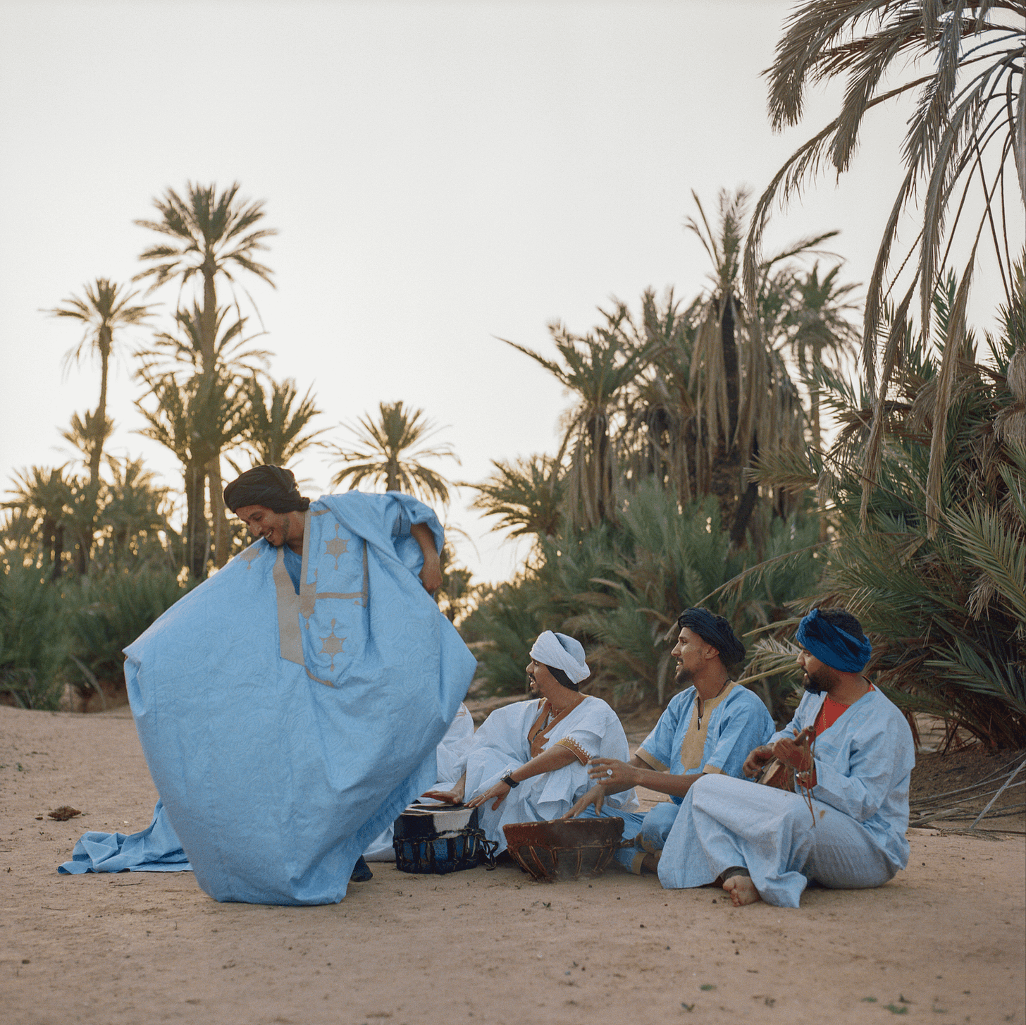 Image may contain People Person Palm Tree Plant Tree Adult Summer Outdoors Clothing Turban Tent Face and Head
