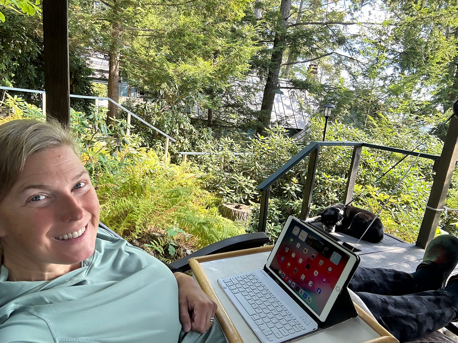 Liz on deck with iPad in lap
