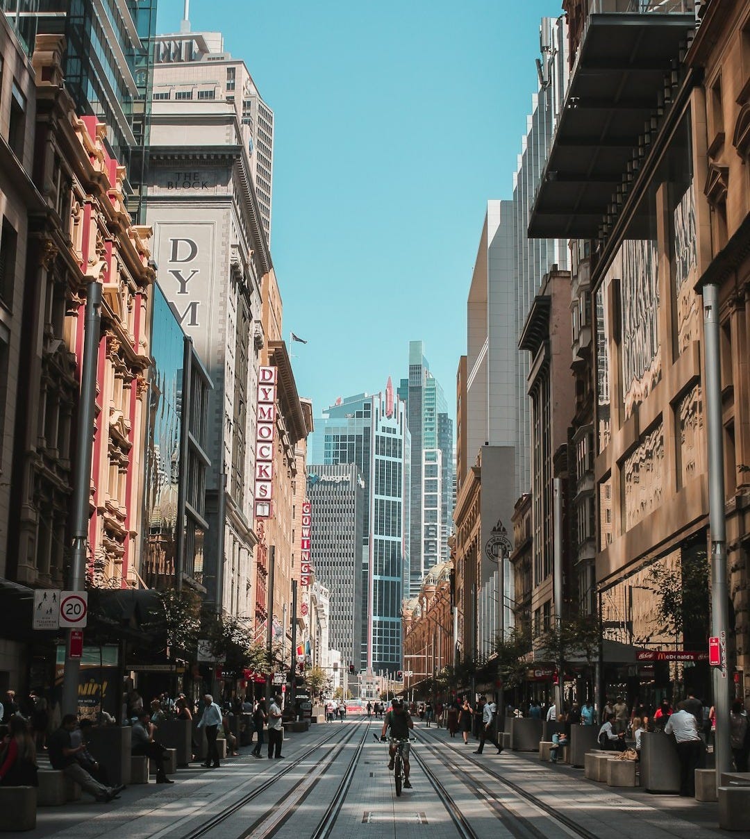 people on marker beside road