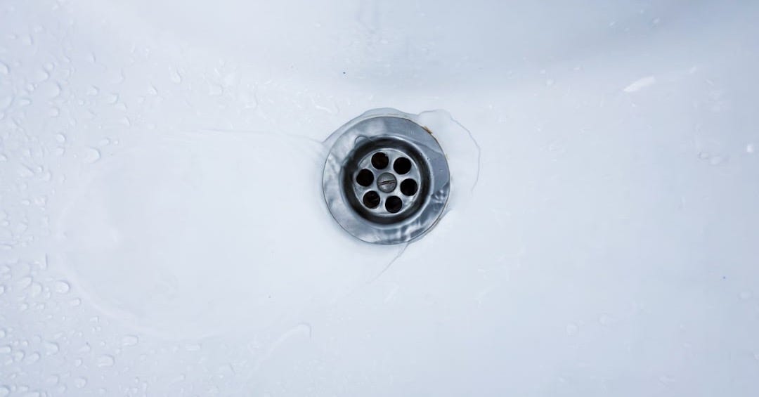 Water drains into a sink.