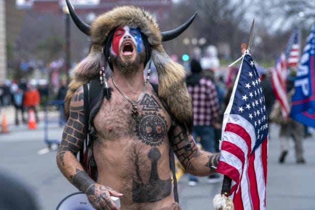 Kim Kelly on X: "The chatter over Jake “Q Shaman” Angeli's identity is  missing a key element: his tattoos. He's covered in Odinist  symbols—Yggdrasil, Mjolnir, and, significantly, the valknut. These Norse  symbols