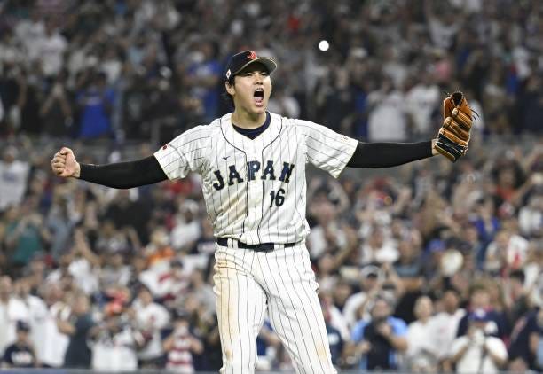 Shohei Ohtani reacts after closing out Japan's World Baseball Classic championship with victory over the United States at loanDepot park in Miami,...