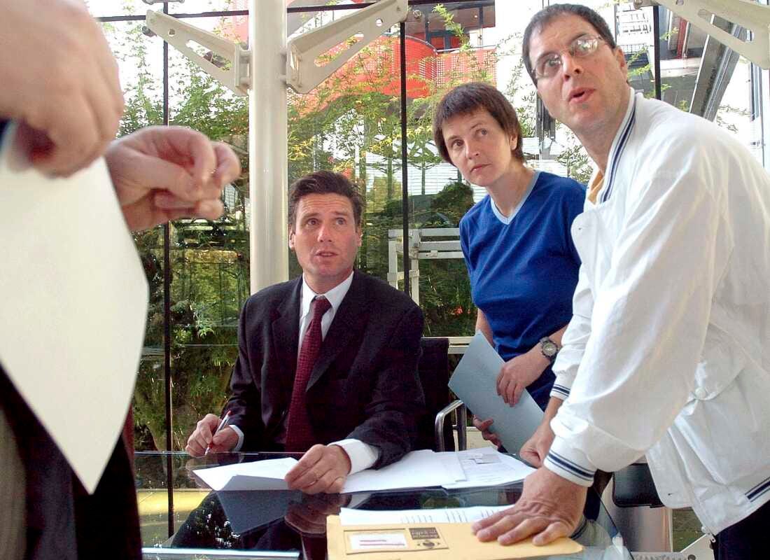 British environmental activists Helen Steel, second right, and David Morris, right, discuss with their lawyer Keir Starmer, seated, as they wait for the beginning of their hearing at the European Court for Human Rights Tuesday Sept. 7, 2004, in Strasbourg, eastern France.