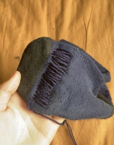 Photos of two different darning projects. One is navy darning on a navy walking sock, showing the process. The other two are of a brown jumper with maroon visible darning, one of the darns, and one when it is being worn.