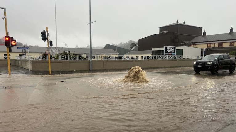 Water gushing at the intersection of Rutherford and Hardy streets in Nelson. 
