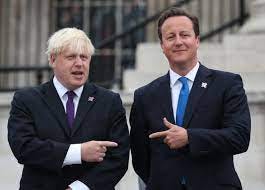 Boris Johnson and David Cameron pointing fingers at each other Boris Johnson and David Cameron pointing fingers at each other