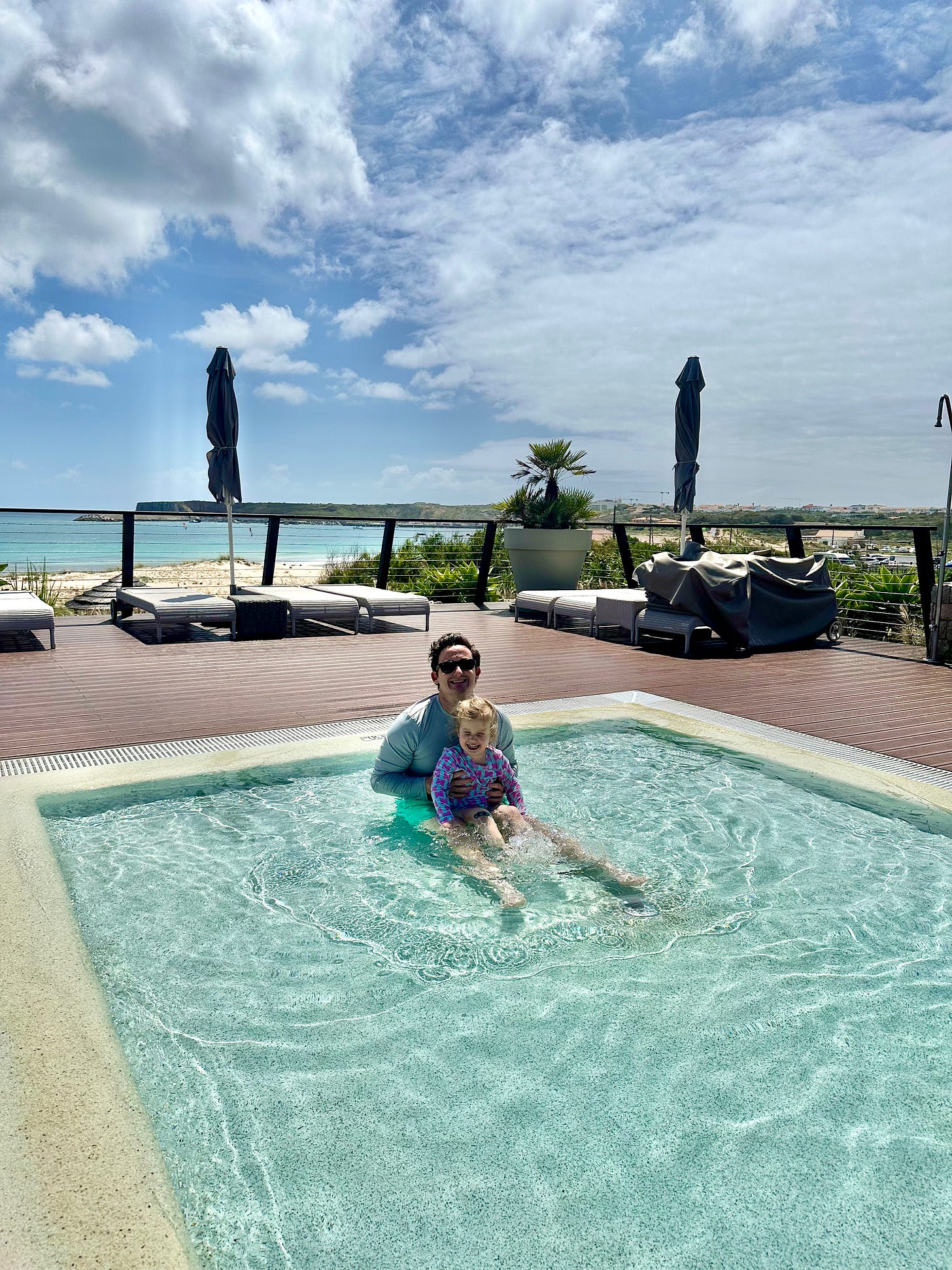 a family in the pool at Martinhal Sagres Beach Family Resort a family in the pool at Martinhal Sagres Beach Family Resort