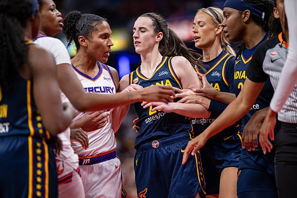 Alyssa Thomas of the Phoenix Mercury and Caitlin Clark of the Indiana Fever get into a scuffle during the game at Gainbridge Fieldhouse on June 22,...