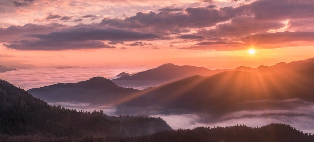 overlooking view of mountains and sunrise