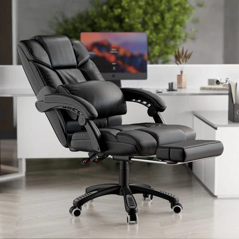 fully reclined black leather office chair with footrest extended in a modern home office workspace