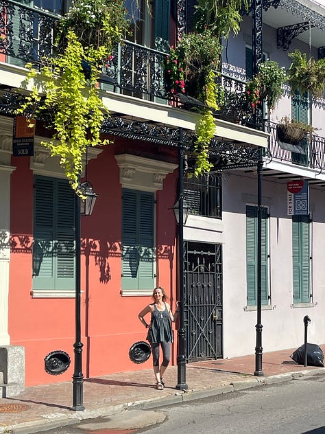 Images of New Orleans' French Quarter + swamp, including iconic balconies dripping in ferns, a swamp gator near Slidell, Jordan in front of blue doors, a cemetary and two tarot card spreads.