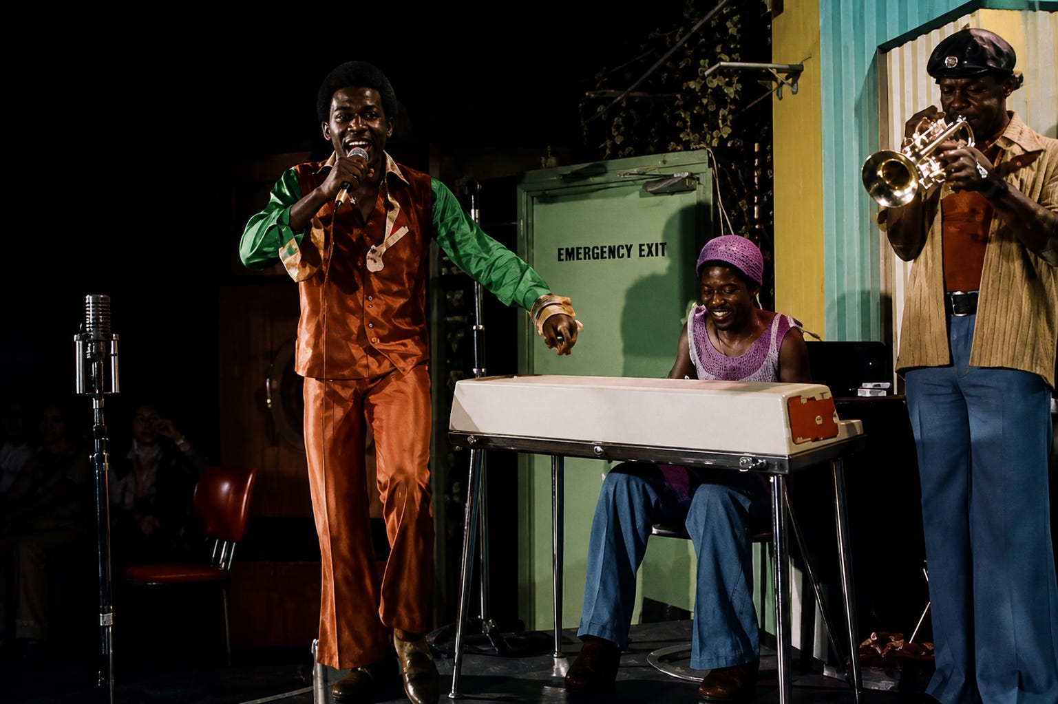 A live band performance channels the energy of Caribbean-influenced music scenes in Britain, where reggae, soul, and funk blended into a new urban sound.