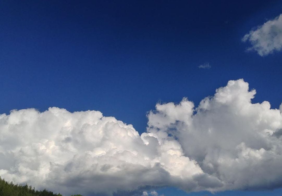 clouds puffy bright blue sky