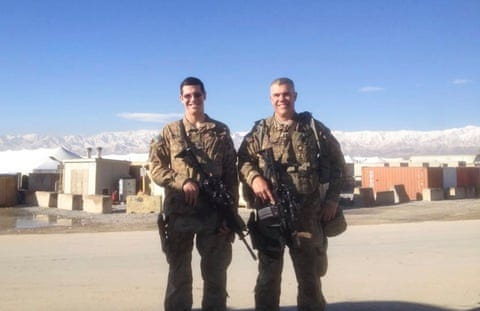 Two soldiers in camouflage uniforms