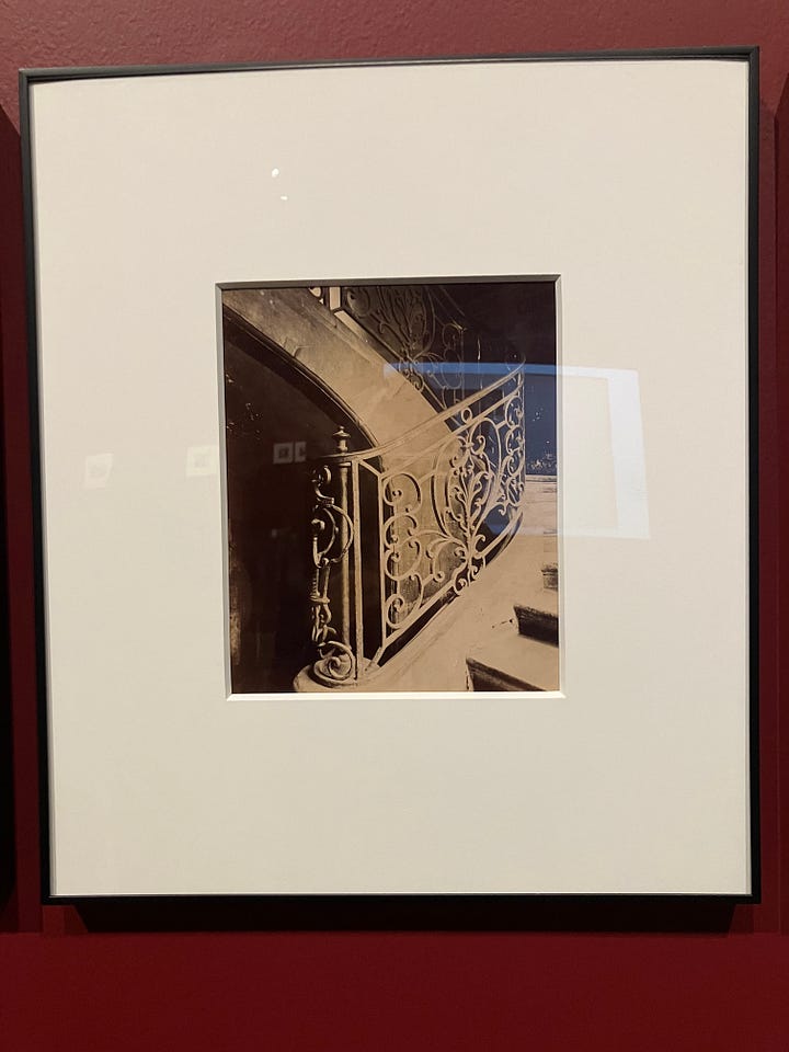 small sepia photographs of curved metal banisters and decorative moldings.