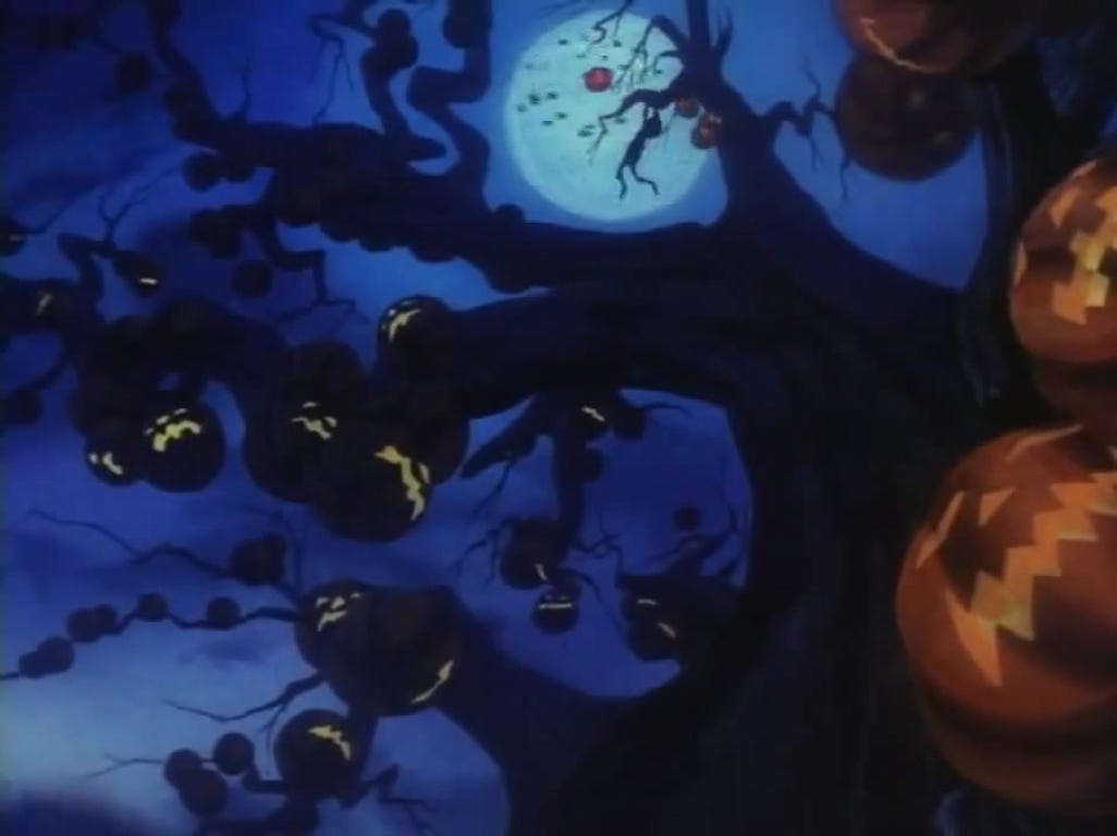Still from The Halloween Tree of a giant tree with pumpkins growing on the branches.