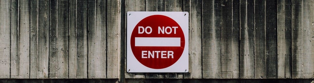 white and red do not enter signage white and red do not enter signage