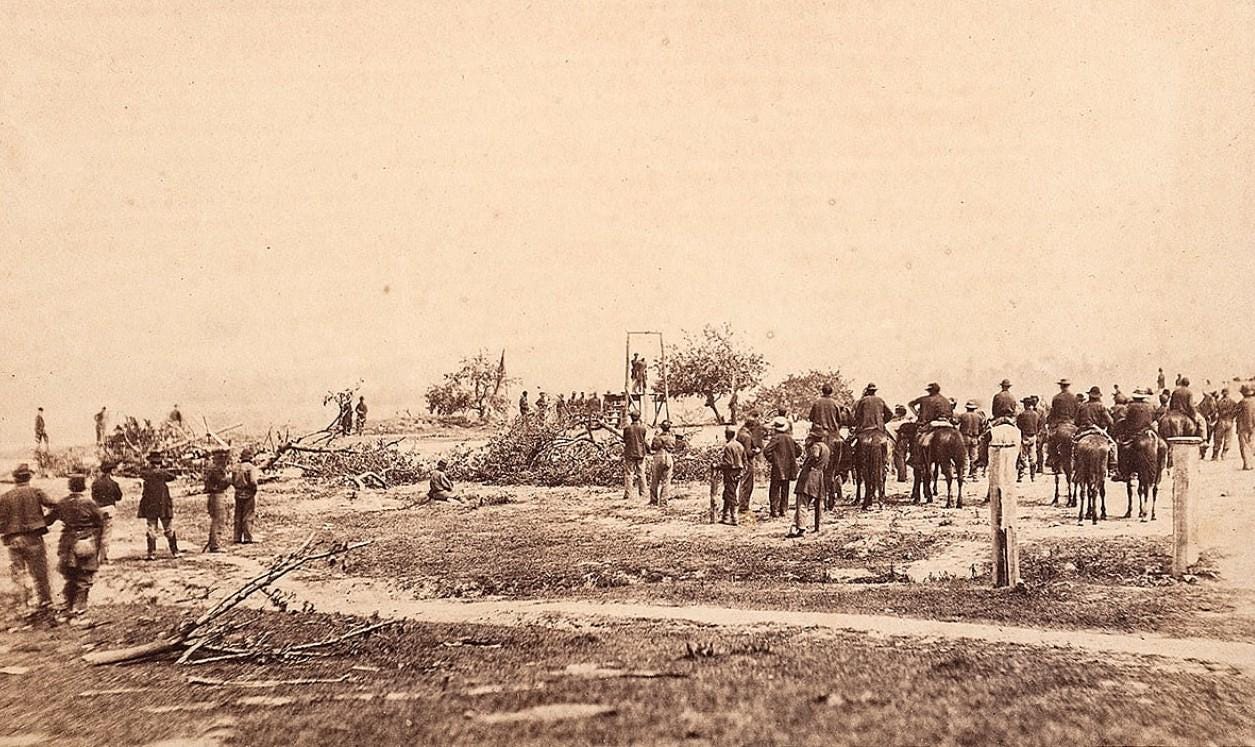 Union soldier William Johnson, 23, stands on the gallows in Virginia, 1864, moments before his execution during the Siege of Petersburg – a grim reminder of military justice during the American Civil War.