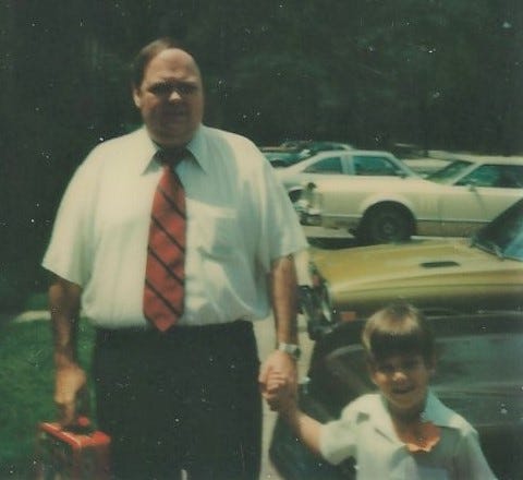 Dad holding my hand on the first day of kindergarten in 1979.