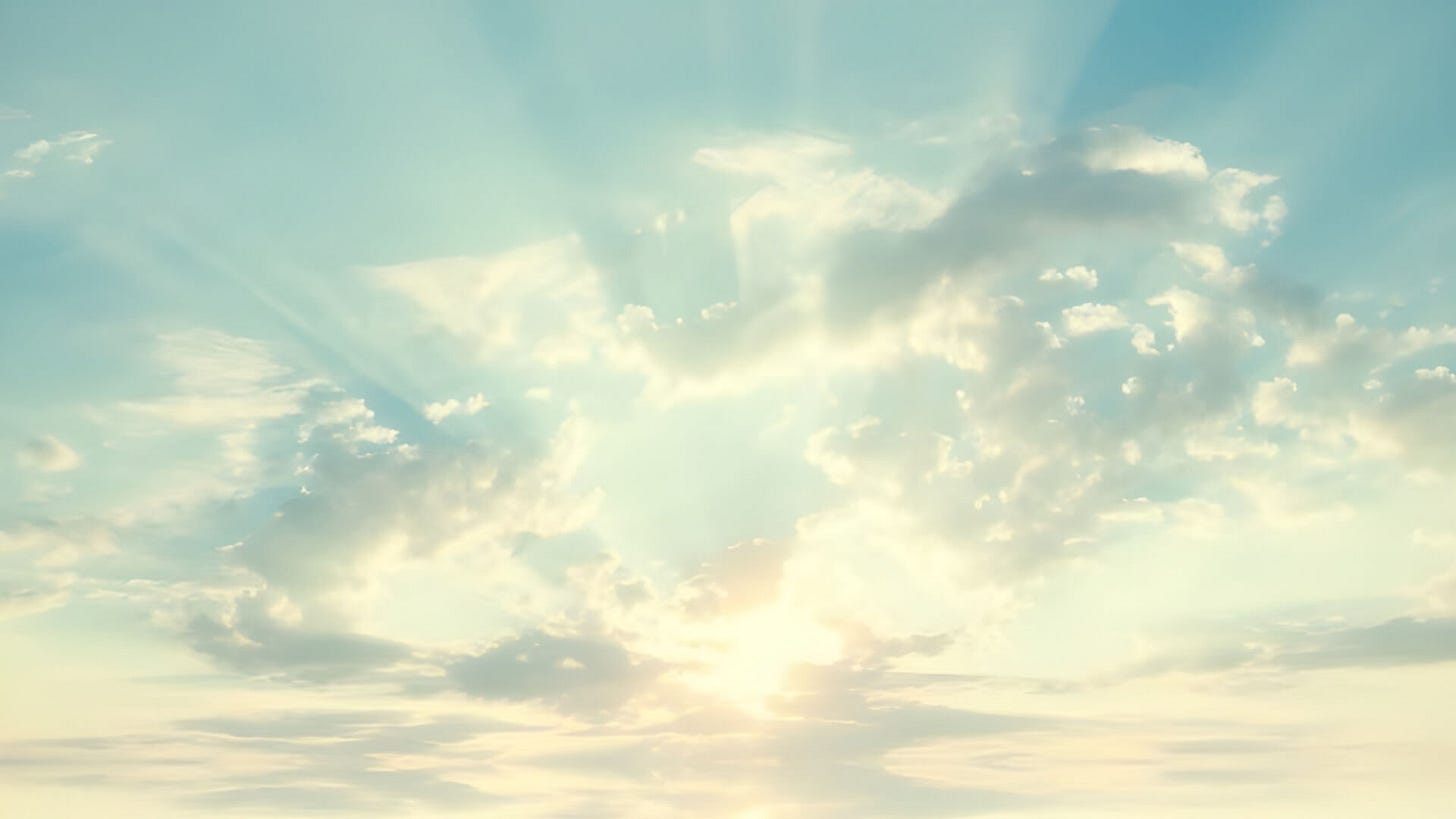 Bright sunlight breaks through soft, scattered clouds in a serene blue sky. Bright sunlight breaks through soft, scattered clouds in a serene blue sky.