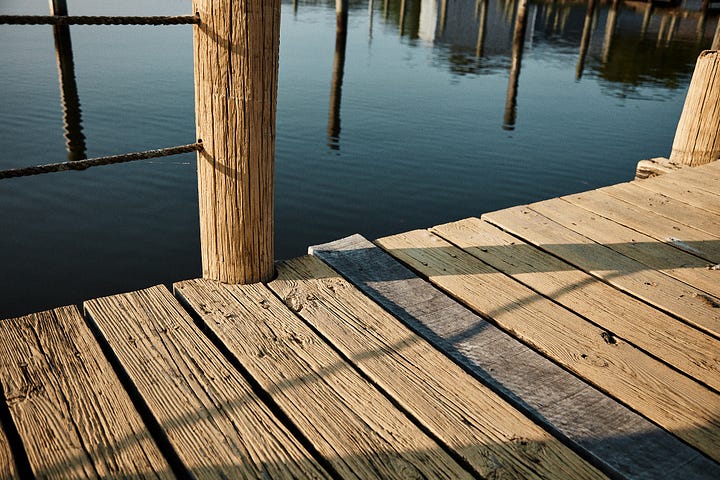 Yellow wood and blue-green water