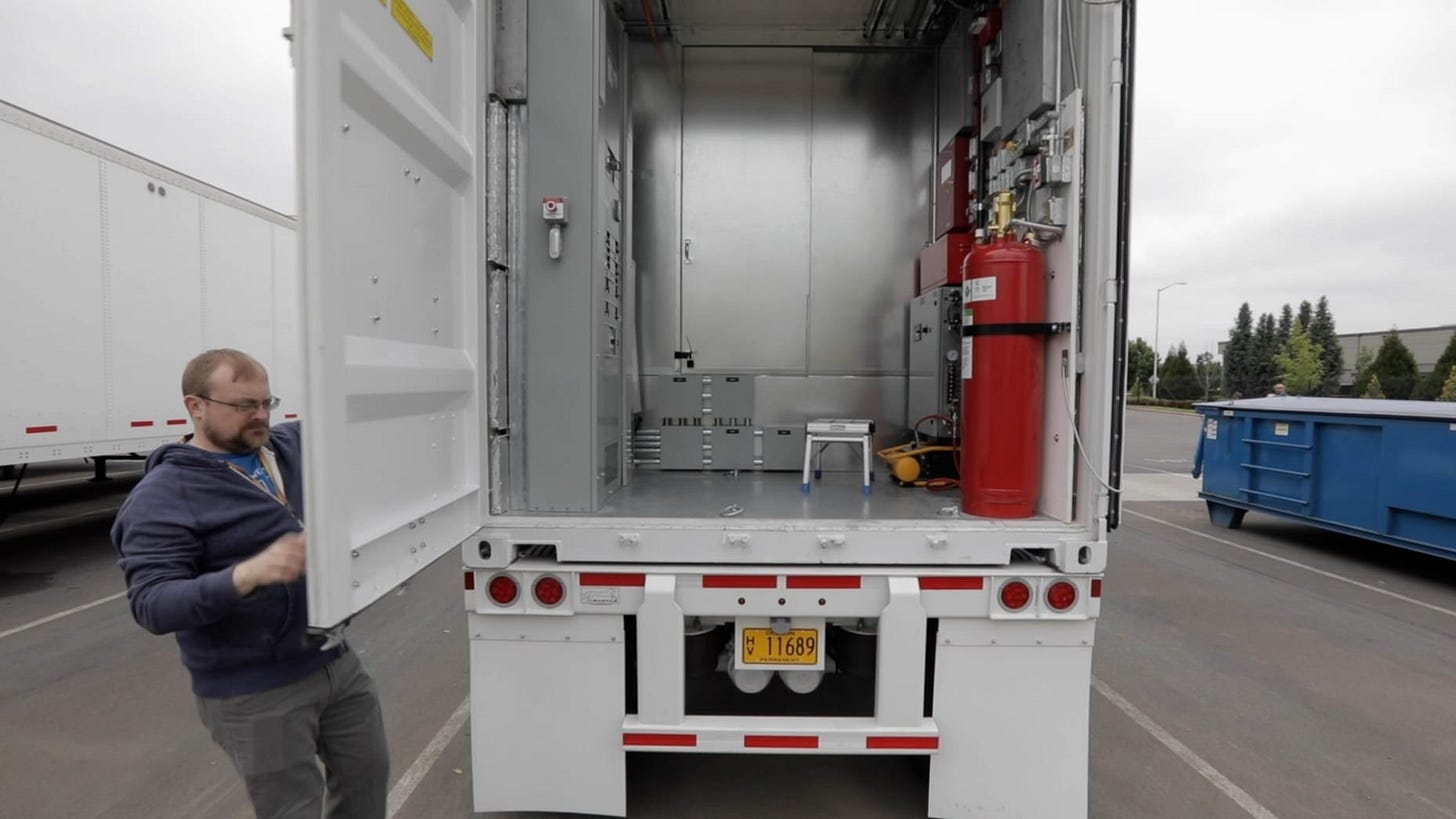 An AWS Snowmobile truck appears in a Seattle parking lot in 2019. An AWS Snowmobile truck appears in a Seattle parking lot in 2019.