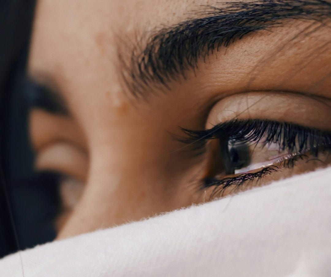 shallow focus of a woman's sad eyes