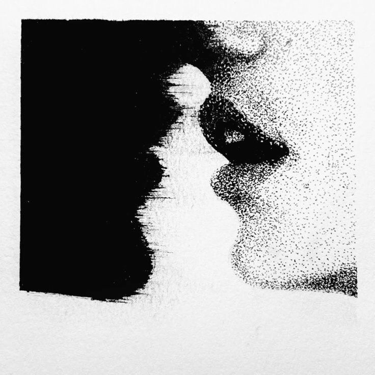 This may contain: a black and white photo of a person's face with small dots on it
