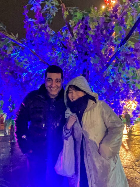 Left: Lighted dragon. Middle: two people in front of blue lighted tree. Right: Girl sticking head in lighted teddy bear cut-out.
