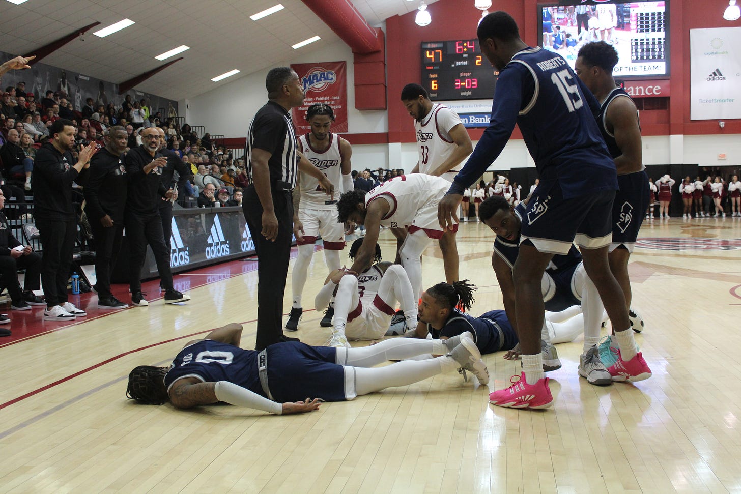 Several players recover and stand up after a fight for the ball during Rider’s 61-56 win over Saint Peter’s on March 8, 2024. (Photo by Adam Zielonka) Several players recover and stand up after a fight for the ball during Rider’s 61-56 win over Saint Peter’s on March 8, 2024. (Photo by Adam Zielonka)