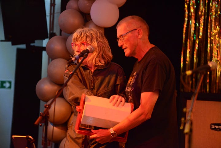 A raffle on stage with a tombola