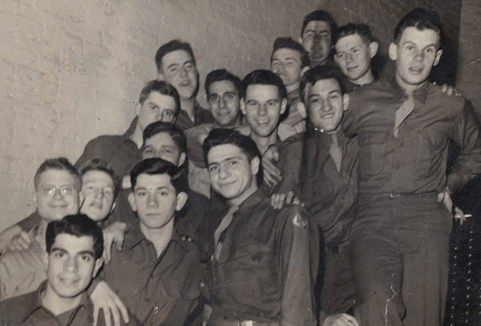 This image has an empty alt attribute; its file name is Battle-of-Bulge-soldiers-young.jpg