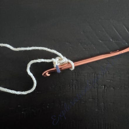 A crochet hook with a string

Description automatically generated