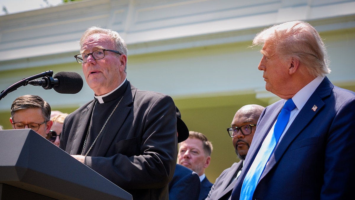 Bishop Robert Barron prays beside President Trump at the National Day of Prayer Bishop Robert Barron prays beside President Trump at the National Day of Prayer