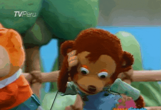 A monkey puppet does a surprised facial expression - its mouth is wide open and it’s looking around. A monkey puppet does a surprised facial expression - its mouth is wide open and it’s looking around.