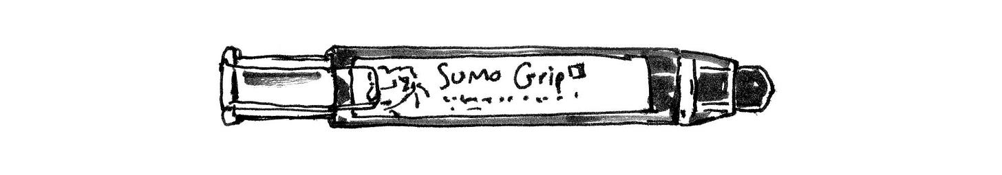 Black and white ink drawing of Sumo Grip Eraser by cartoonist K. Woodman-Maynard. 
