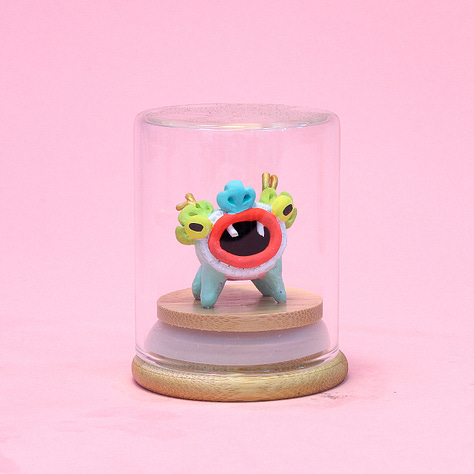 6 images of baby dragon sculptures each in a small glass jar