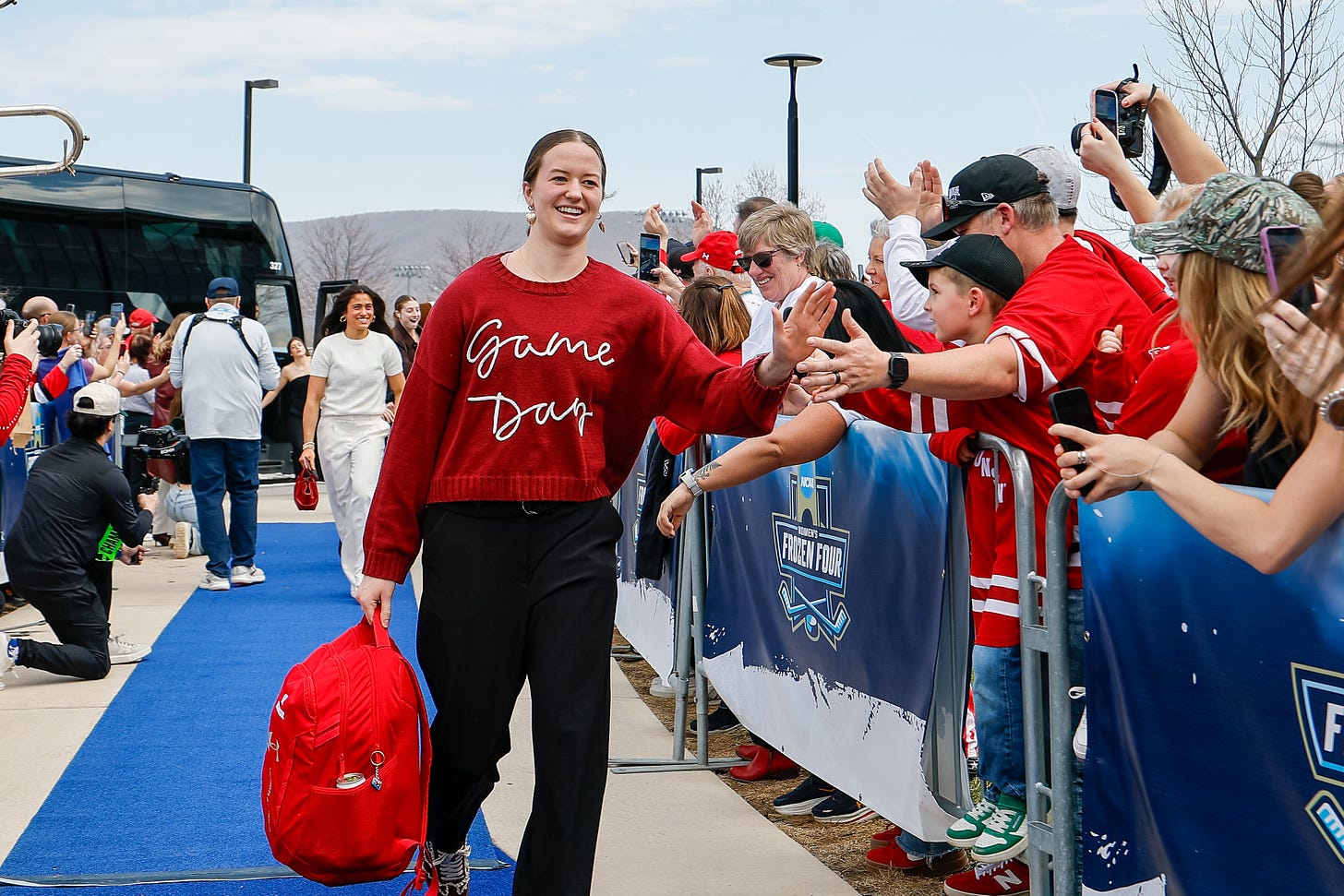 Wisconsin women's hockey forward Maggie Scannell wearing a sweater with 'game day' embroidered on the front