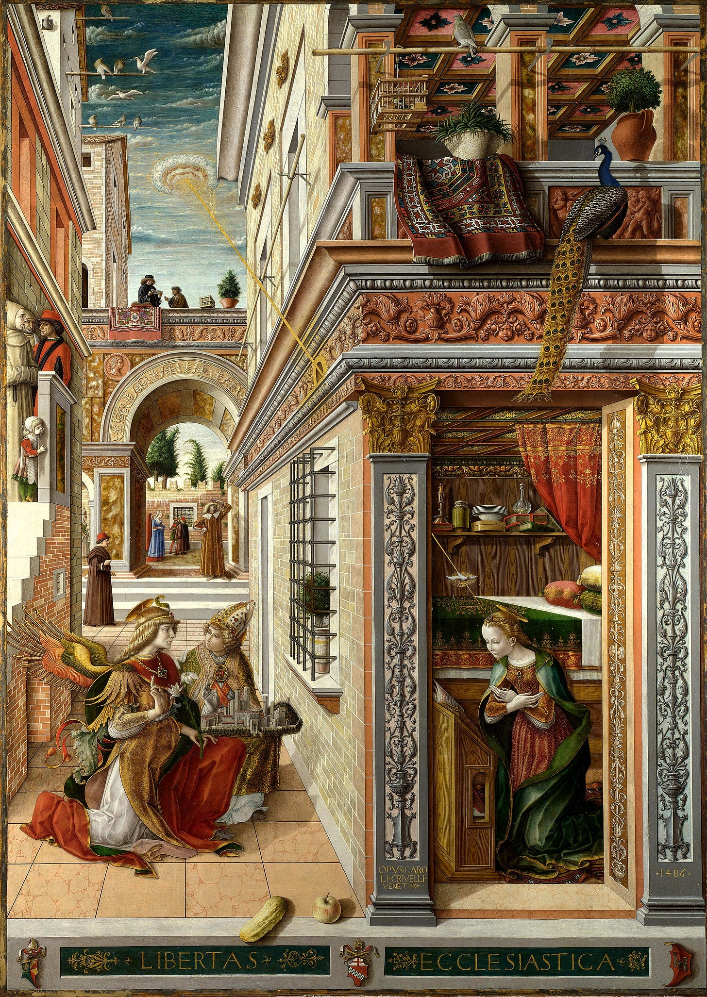 A long street of Renaissance palaces runs into the distance. On the left, the angel Gabriel kneels in the street beside a saint holding a small model of a walled town. On the right, through an open wall, Mary kneels in a richly furnished room as a thin golden ray falls on her from the sky. A peacock sits on the cornice and people watch from a bridge and a stair.