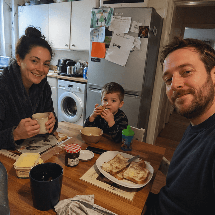DALL-E 2 vs. GPT Image 2 candid photos of a family eating breakfast in a small kitchen.