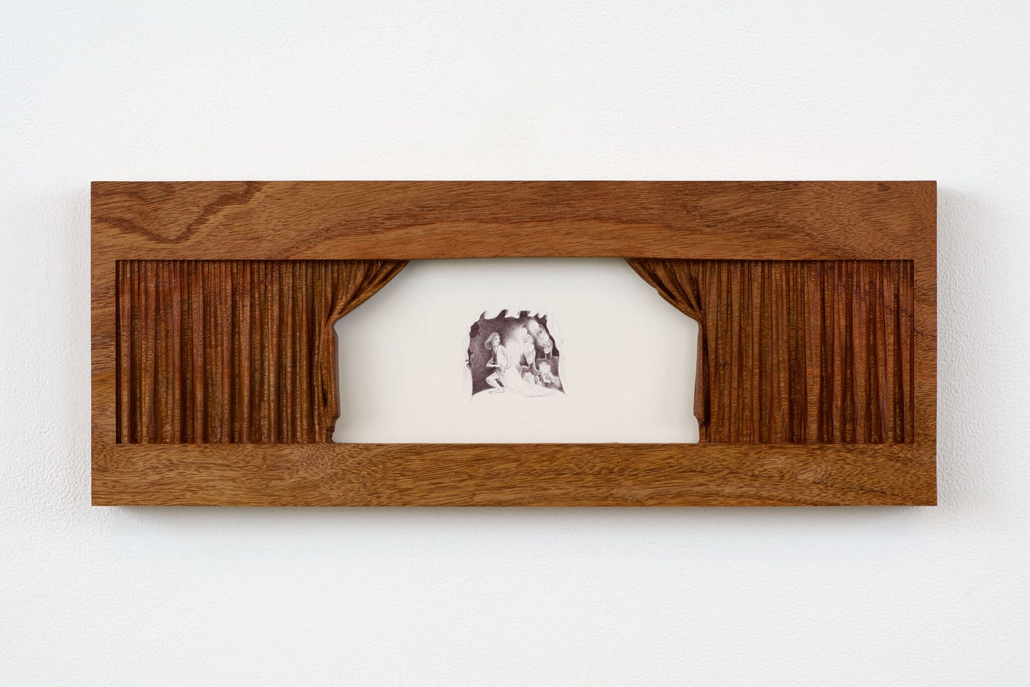 A stage with proscenium curtains carved in wood reveals a scene in miniature figures just too small to make out.