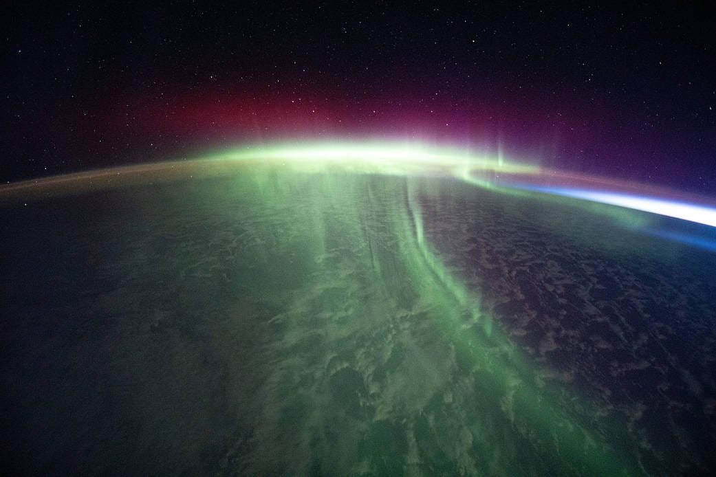 A vivid aurora streams over the Earth A vivid aurora streams over the Earth